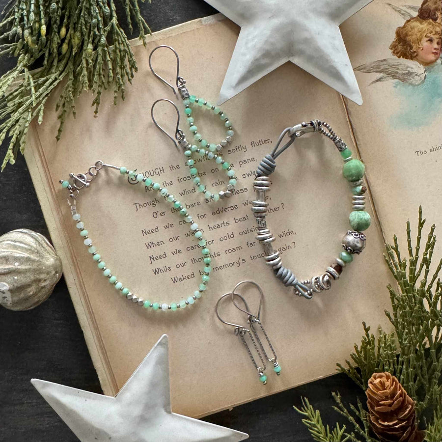 Frosted Mint chrysoprase bracelets and earrings with Thai silver and sterling accents on a vintage holiday book with greenery and white star decor.