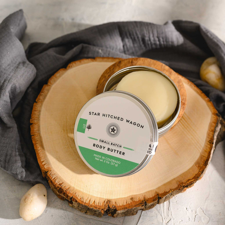Liz body butter moisturizer in reusable tin, crafted with rich oils and butters to soothe dry skin. Cool, minty, and refreshing.