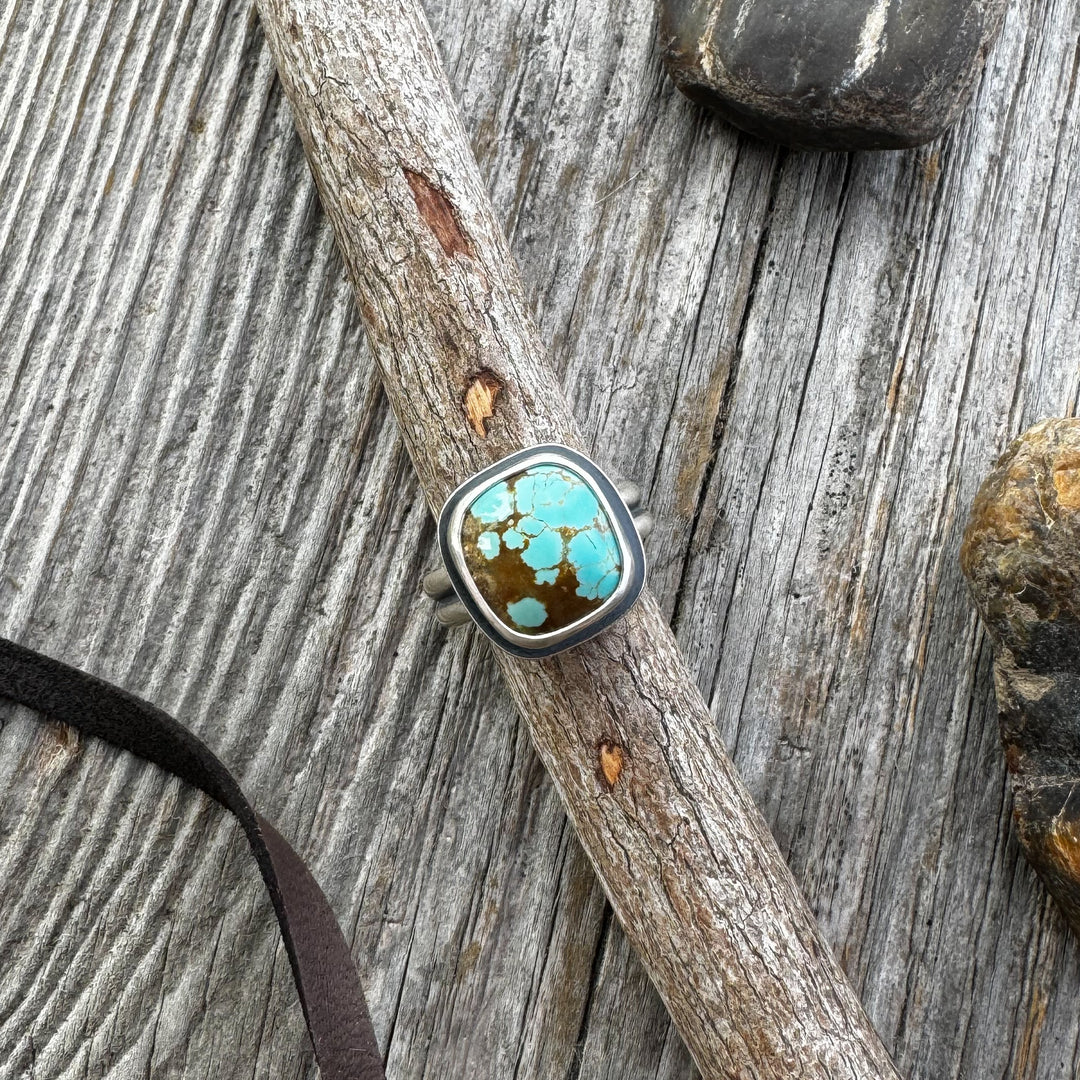 The Drift Ring — Chunky Turquoise Ring in Sterling Silver on a wooden surface